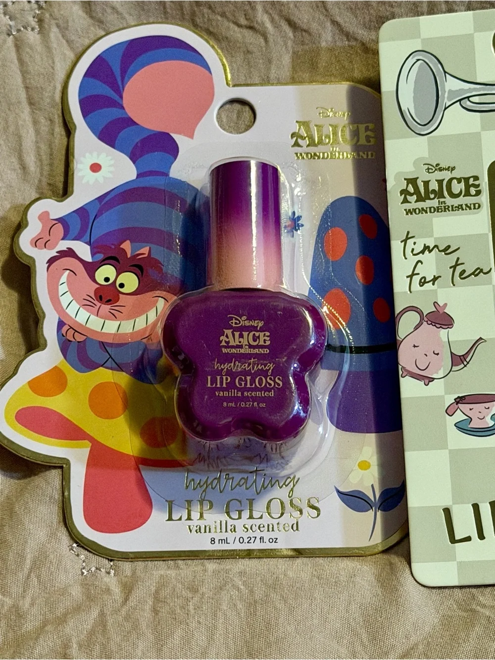 4 piece Alice in Wonderland Lip Gloss & Balm Set - Purple, Gold, Pink, Blue